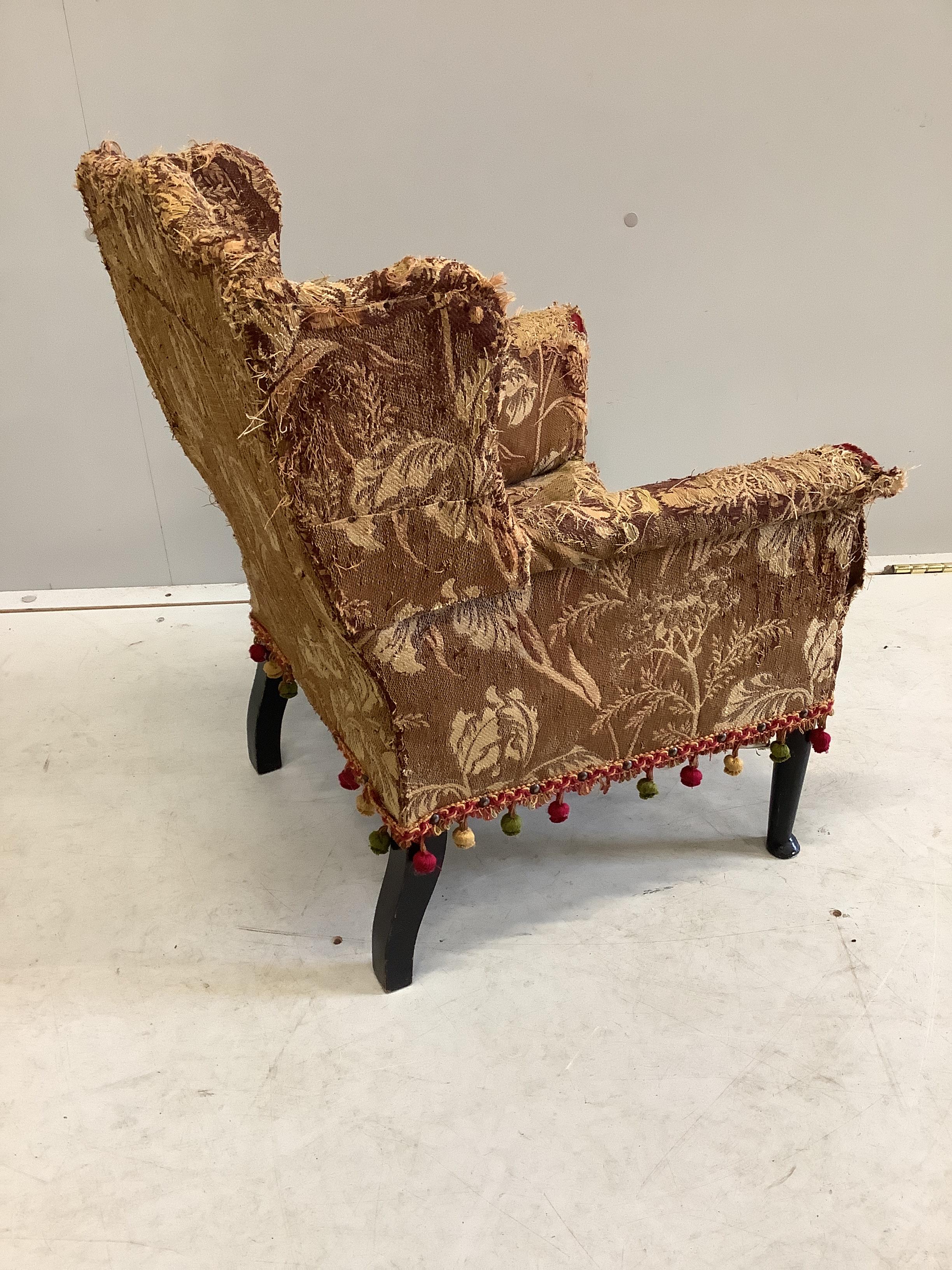 A late 19th century upholstered child's wing armchair, width 46cm, depth 45cm, height 60cm